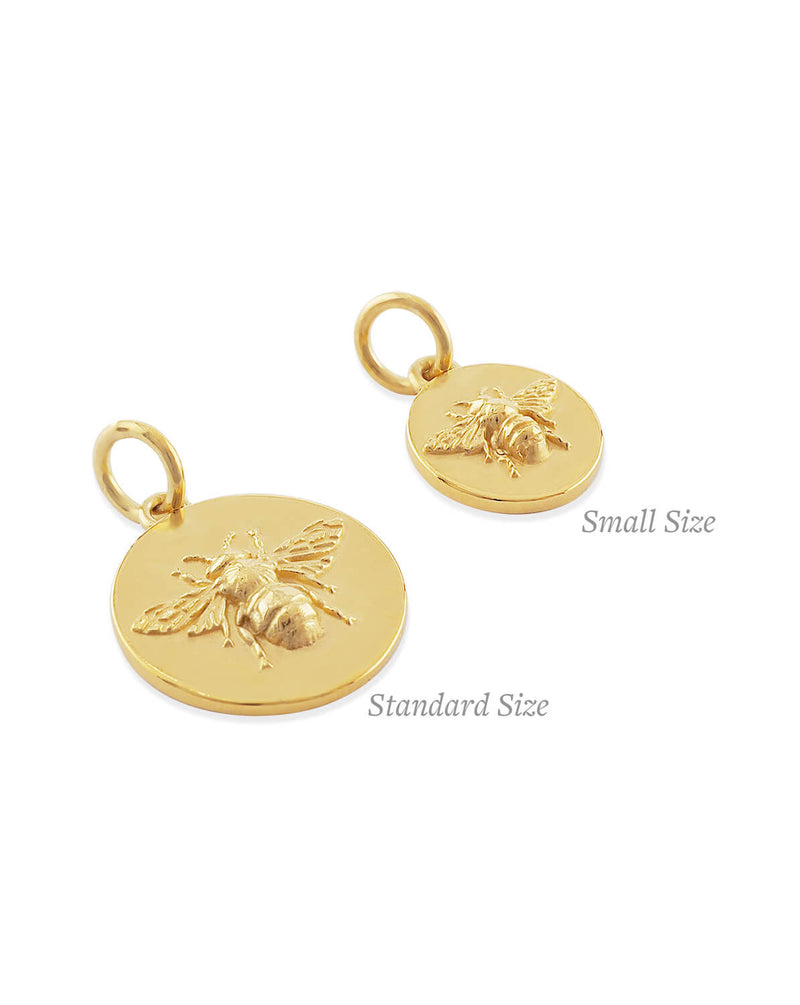 size comparison image between large and small round solid gold bee coin pendant 