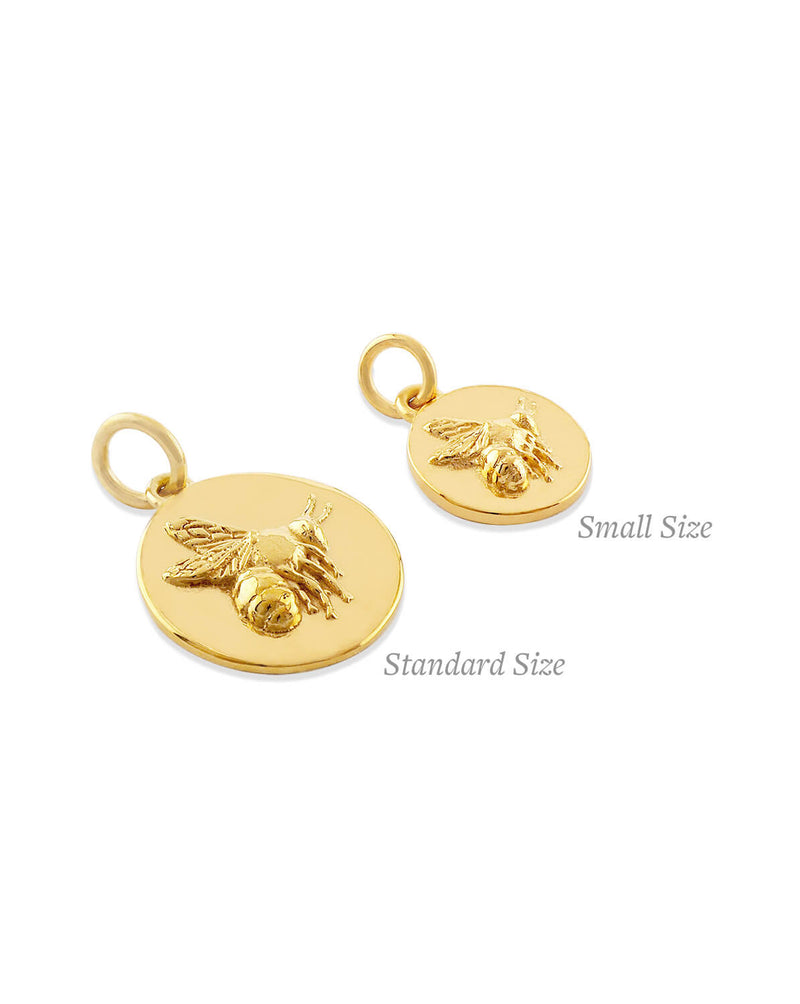 comparison photo of small and large flying bee coin pendant 